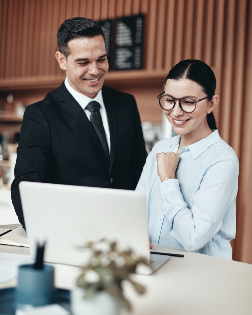 two-smiling-businesspeople-using-a-laptop-together-in-an-office.jpg two-smiling-businesspeople-using-a-laptop-together-in-an-office.jpg